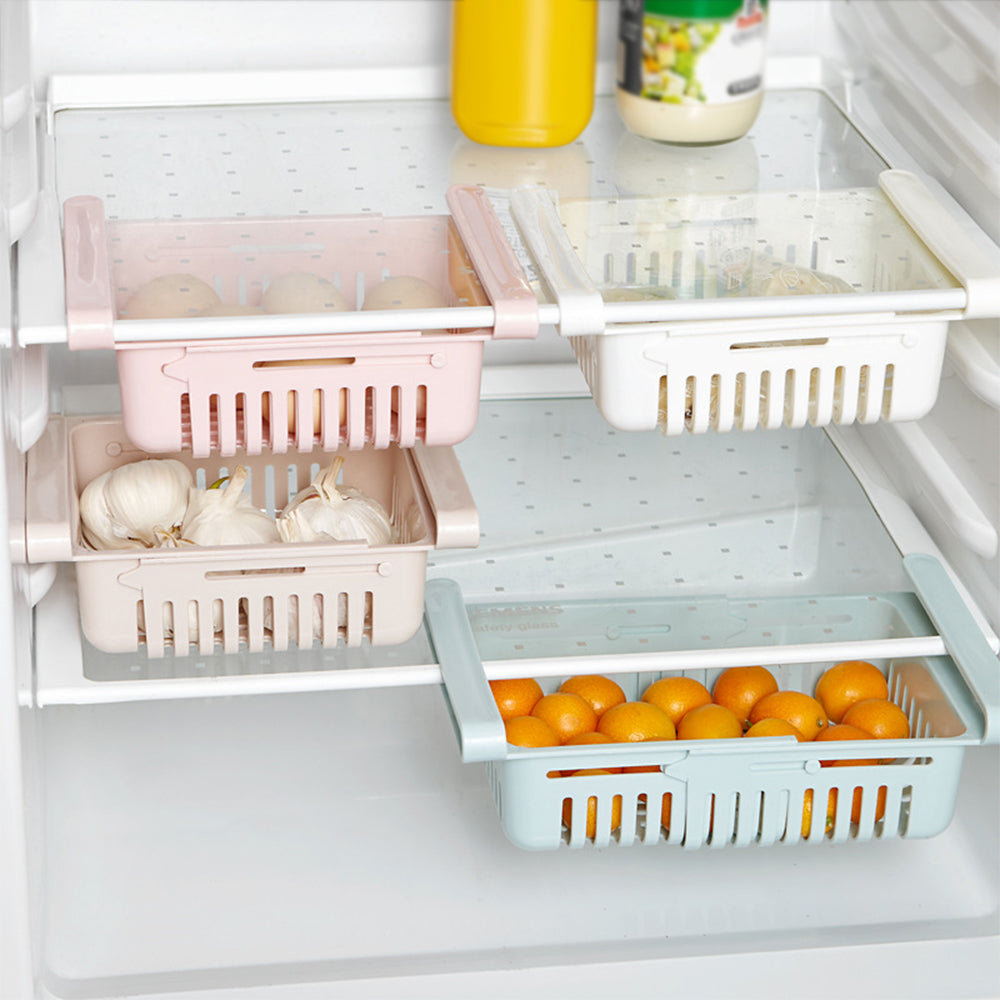 Adjustable fridge storage basket, stretchable plastic organizer for keeping food neatly arranged in your refrigerator.