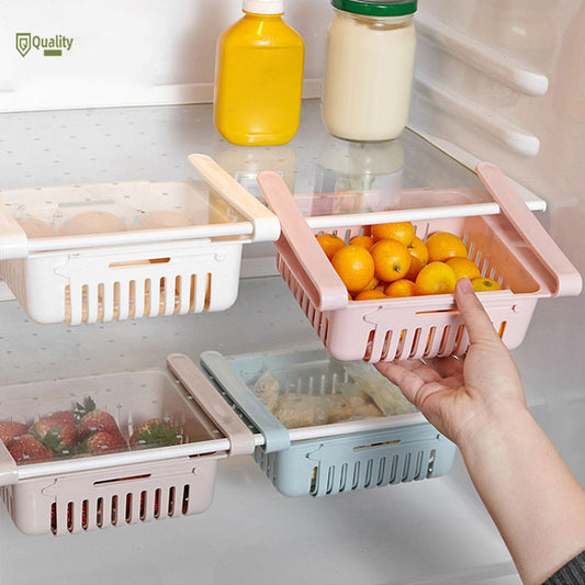Adjustable fridge storage basket, stretchable plastic organizer for keeping food neatly arranged in your refrigerator.