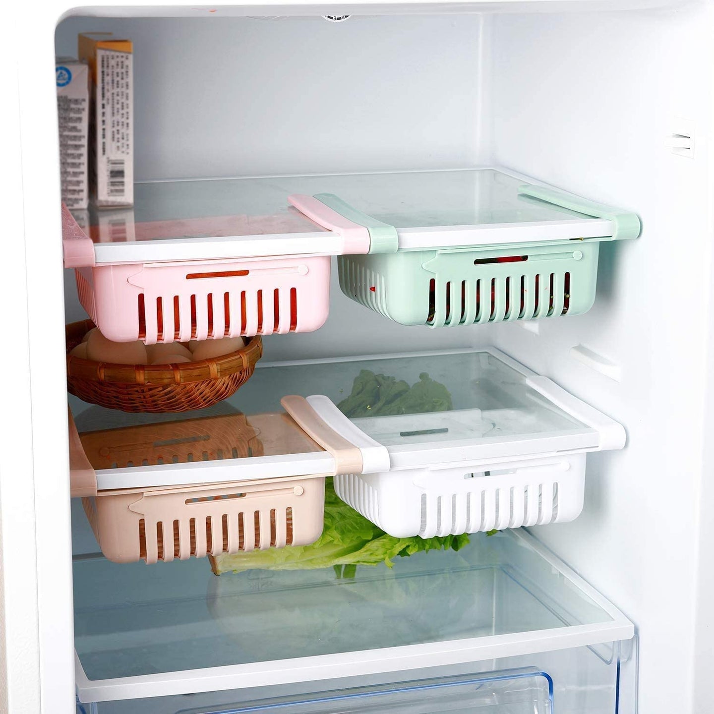 Adjustable fridge storage basket, stretchable plastic organizer for keeping food neatly arranged in your refrigerator.