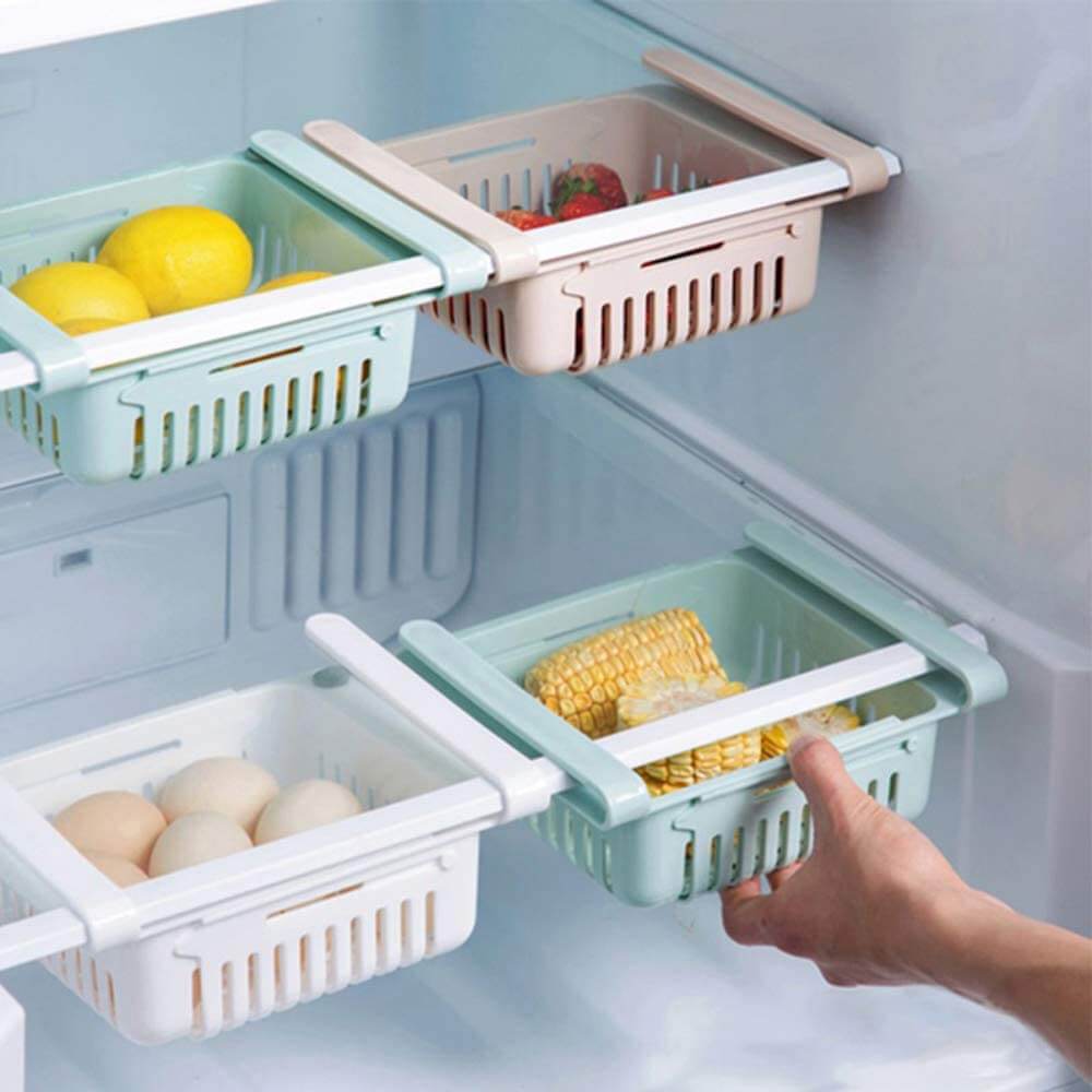 Adjustable fridge storage basket, stretchable plastic organizer for keeping food neatly arranged in your refrigerator.