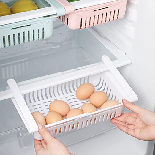 Adjustable fridge storage basket, stretchable plastic organizer for keeping food neatly arranged in your refrigerator.